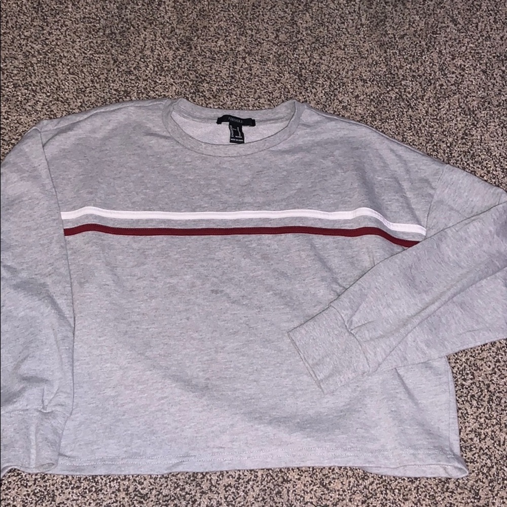A medium cropped forever 21 long sleeve shirt.